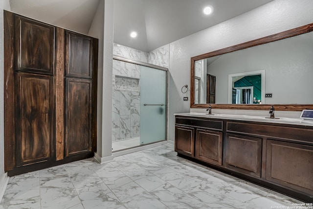 12177 Tower Frst, San Antonio, TX 78253 - full bathroom with marble finish floor, vaulted ceiling, double vanity, a sink, and a stall shower