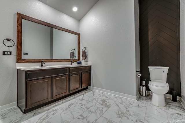 12177 Tower Frst, San Antonio, TX 78253 - bathroom with a sink, double vanity, toilet, baseboards, and marble finish floor