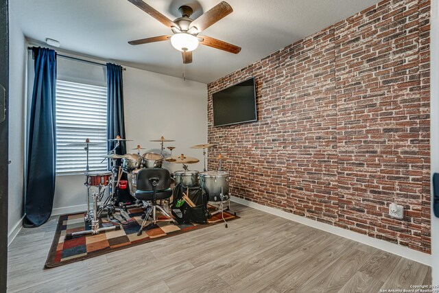 12177 Tower Frst, San Antonio, TX 78253 - game room featuring brick wall, a ceiling fan, and baseboards