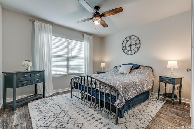 12177 Tower Frst, San Antonio, TX 78253 - bedroom featuring baseboards, a ceiling fan, and wood finished floors