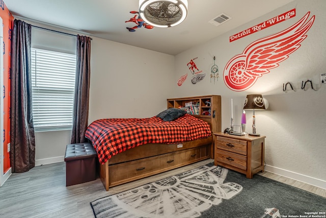 12177 Tower Frst, San Antonio, TX 78253 - bedroom featuring baseboards, wood finished floors, and visible vents