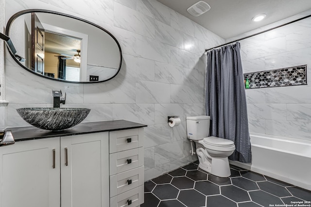 12177 Tower Frst, San Antonio, TX 78253 - full bath with tile patterned floors, vanity, tile walls, toilet, and visible vents