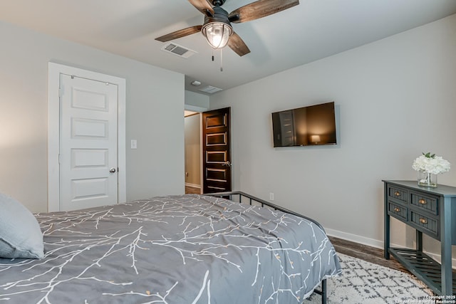 12177 Tower Frst, San Antonio, TX 78253 - bedroom featuring baseboards, a ceiling fan, wood finished floors, and visible vents
