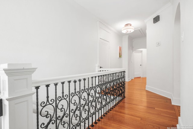 204 Parklane, Olmos Park, TX 78212 - hall featuring arched walkways, light wood-style flooring, crown molding, and baseboards