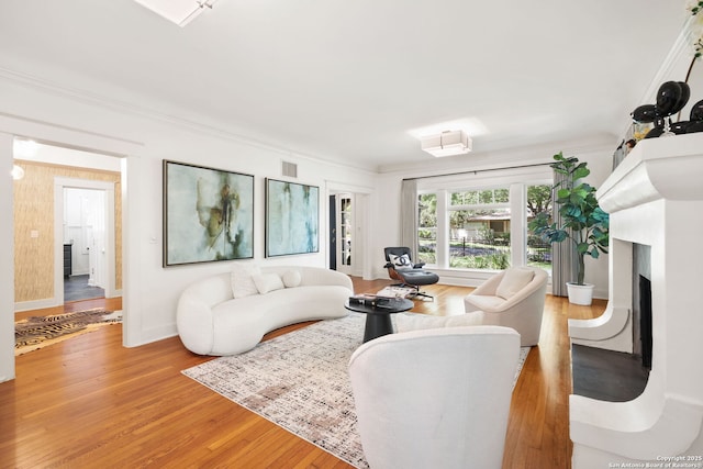 204 Parklane, Olmos Park, TX 78212 - living area featuring a fireplace, light wood-type flooring, and baseboards