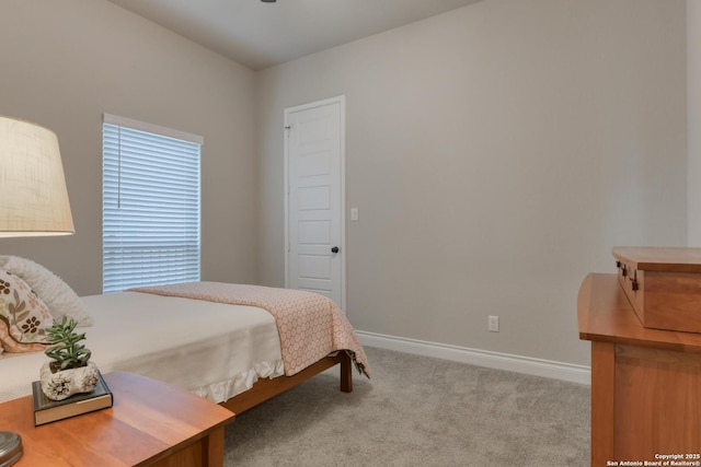 bedroom with carpet and baseboards