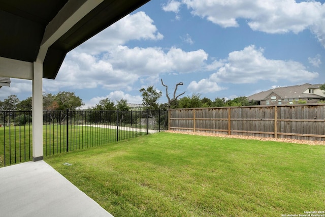 view of yard with a fenced backyard