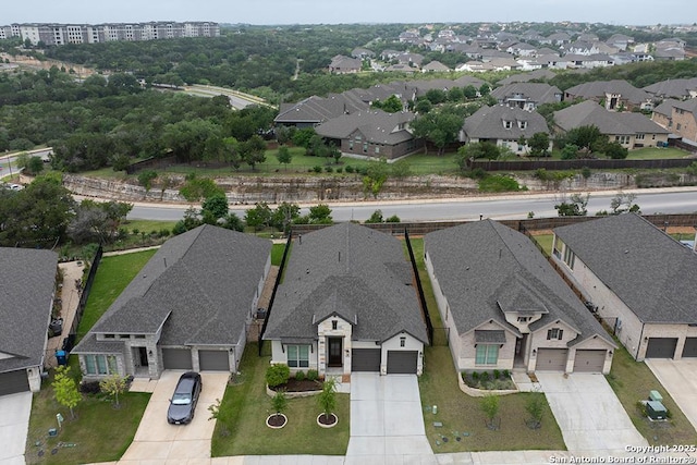 birds eye view of property with a residential view