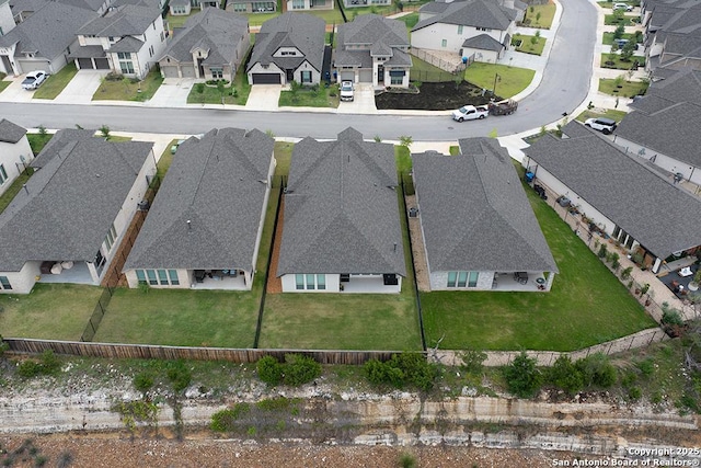 birds eye view of property with a residential view