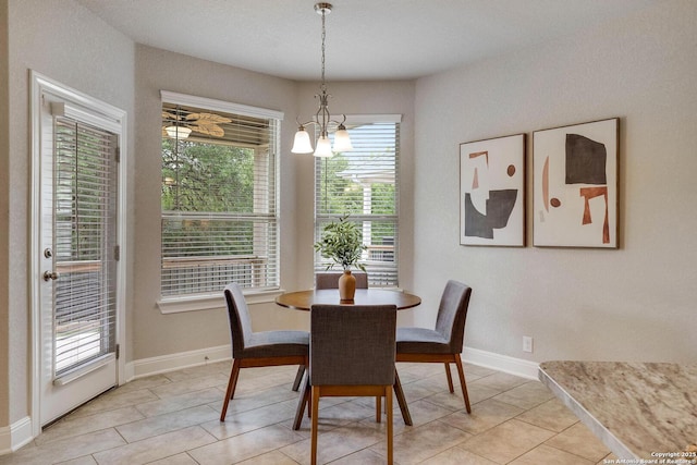 27314 Falls Cv, Boerne, TX 78015 - dining space with baseboards, a notable chandelier, and light tile patterned floors