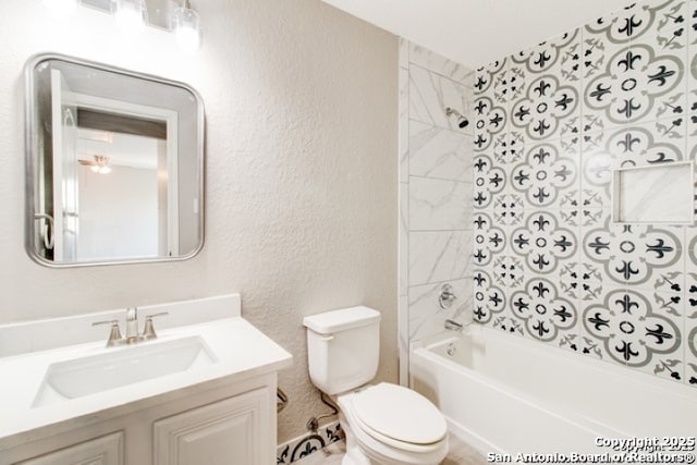 full bathroom with washtub / shower combination, toilet, a textured wall, and vanity