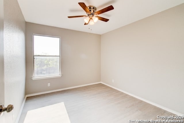 unfurnished room with baseboards, a ceiling fan, and light wood finished floors