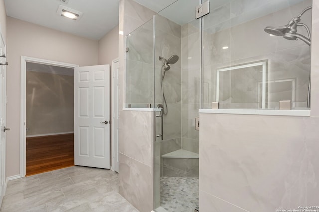 full bathroom featuring a shower stall