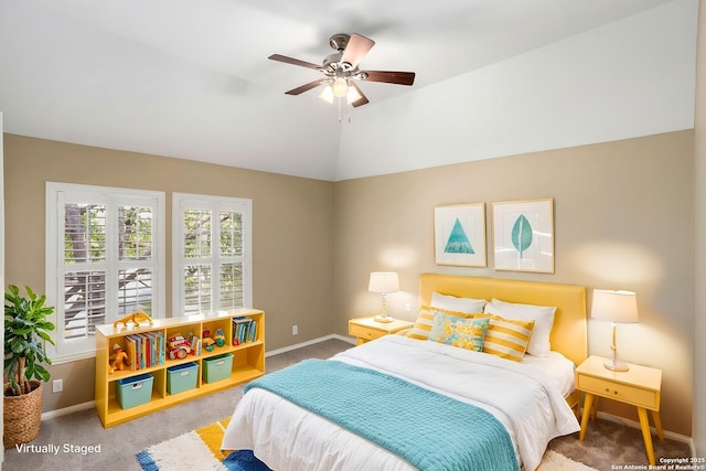 bedroom featuring a ceiling fan, vaulted ceiling, carpet floors, and baseboards