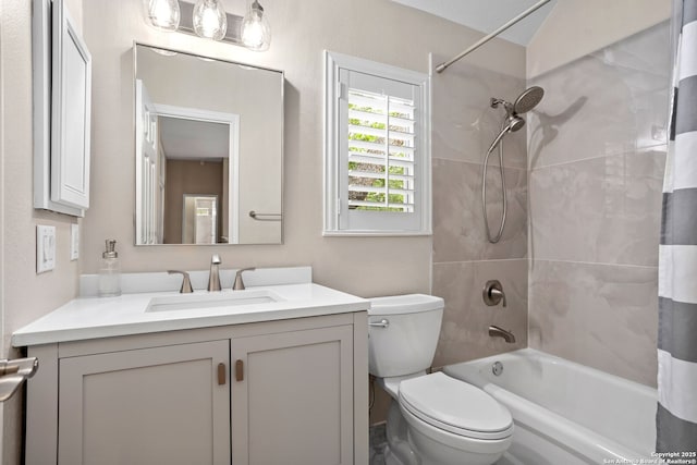 full bath with shower / bath combo, vanity, and toilet