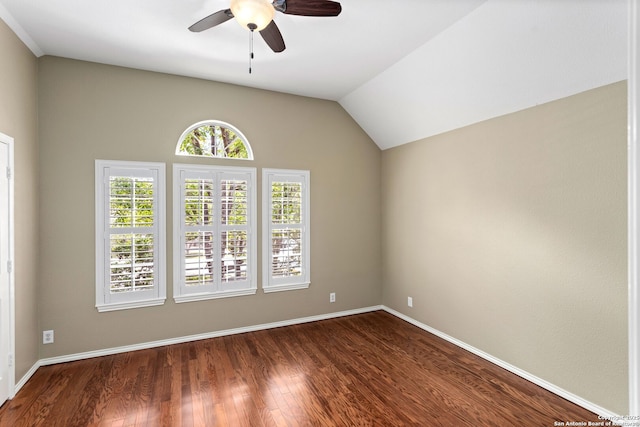 spare room featuring ceiling fan, baseboards, lofted ceiling, and dark wood-type flooring