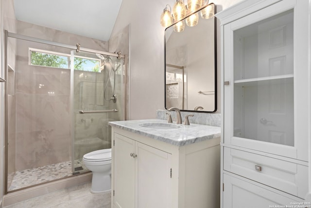 bathroom featuring tile patterned flooring, a shower stall, toilet, vanity, and lofted ceiling