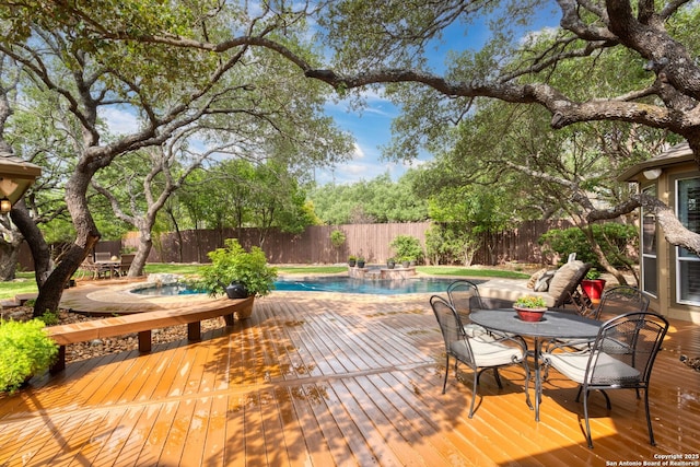 wooden deck featuring a fenced in pool, a fenced backyard, and a jacuzzi