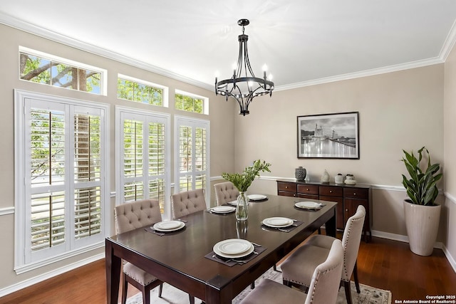 dining space with a chandelier, a healthy amount of sunlight, crown molding, and dark wood-style floors