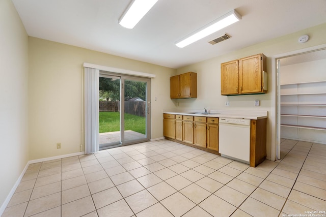 6635 Meadow Dawn, Converse, TX 78109 - kitchen with light countertops, dishwasher, a sink, baseboards, and visible vents