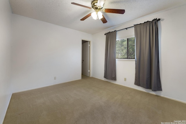6635 Meadow Dawn, Converse, TX 78109 - unfurnished room with a textured ceiling, ceiling fan, carpet floors, and baseboards