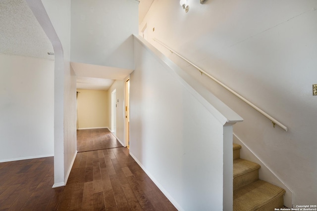 6635 Meadow Dawn, Converse, TX 78109 - corridor with dark wood-style floors, stairway, and baseboards