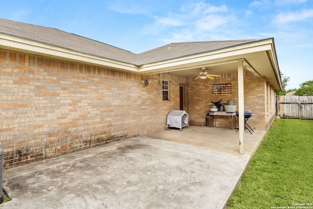 view of patio with a ceiling fan and fence