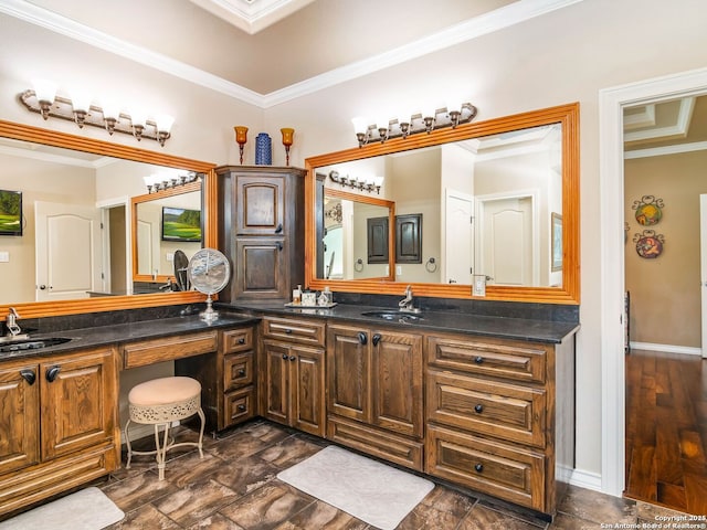 full bathroom featuring ornamental molding, double vanity, and a sink