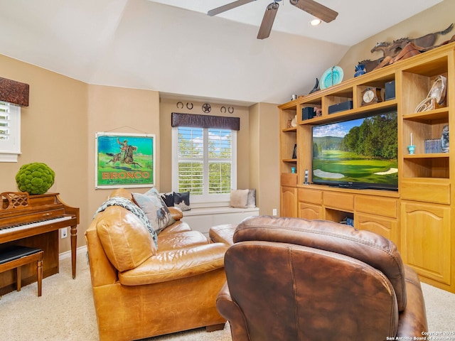 living area featuring baseboards, light carpet, lofted ceiling, and ceiling fan