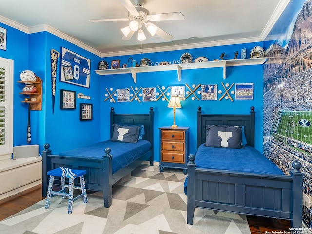 bedroom featuring wood finished floors, a ceiling fan, and crown molding