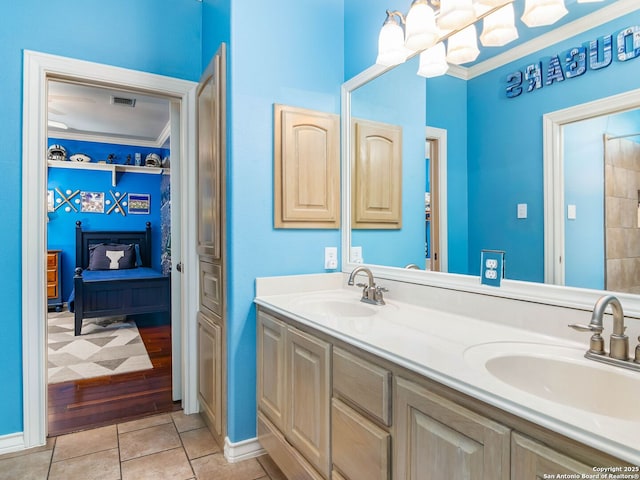 full bathroom with double vanity, a sink, tile patterned floors, and visible vents
