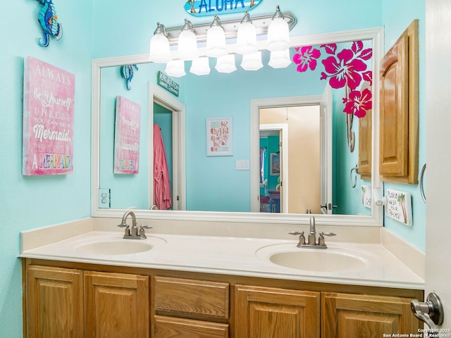 bathroom featuring double vanity and a sink