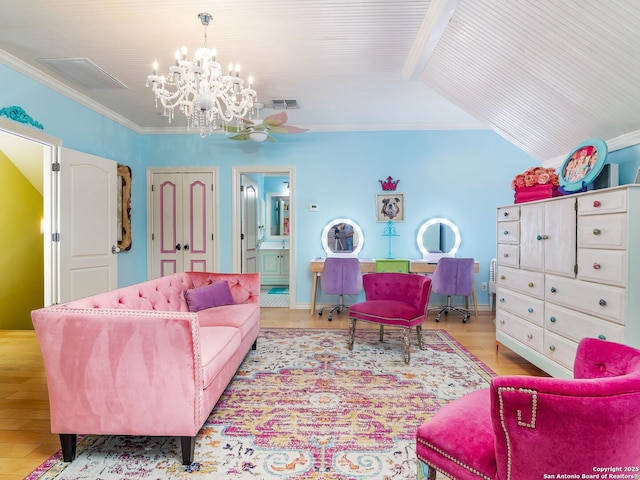 living area with vaulted ceiling, light wood-type flooring, ceiling fan with notable chandelier, visible vents, and crown molding