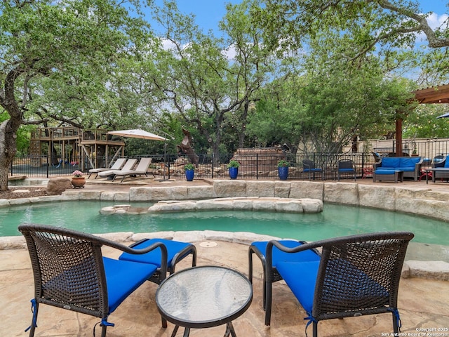 view of pool featuring fence, a patio area, and a fenced in pool