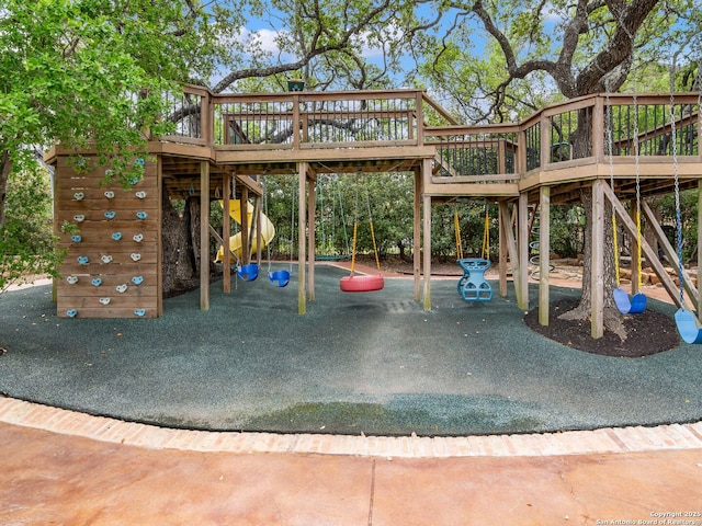 view of jungle gym featuring a deck and stairs