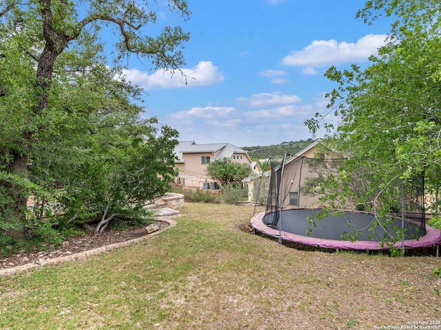 view of yard featuring a trampoline