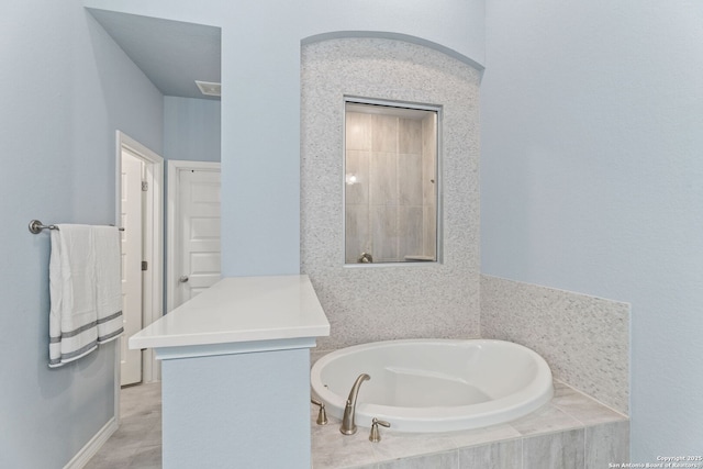 bathroom featuring a garden tub