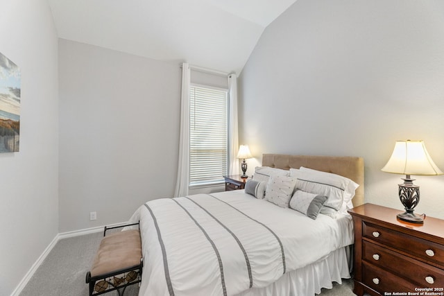 carpeted bedroom featuring vaulted ceiling and baseboards