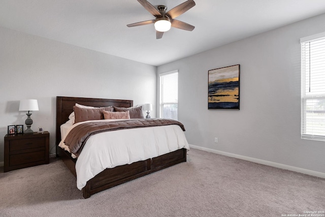 carpeted bedroom featuring a ceiling fan and baseboards
