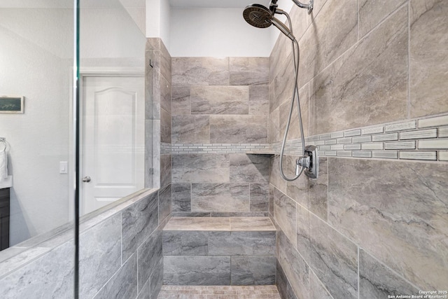 bathroom featuring tiled shower