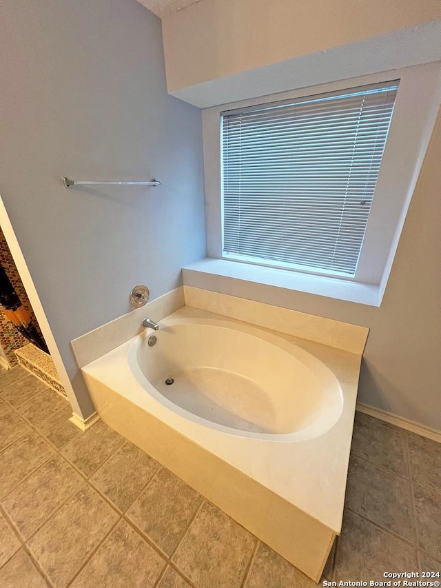 7514 Autumn Ledge, Converse, TX 78109 - full bathroom featuring tile patterned floors, a bath, and baseboards