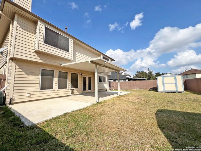 7514 Autumn Ledge, Converse, TX 78109 - back of house featuring a patio, a storage unit, a fenced backyard, and a yard