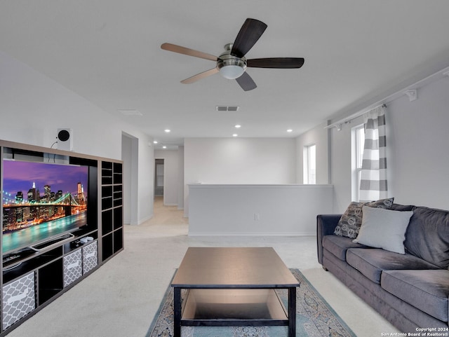 living room featuring visible vents, a ceiling fan, light carpet, and recessed lighting