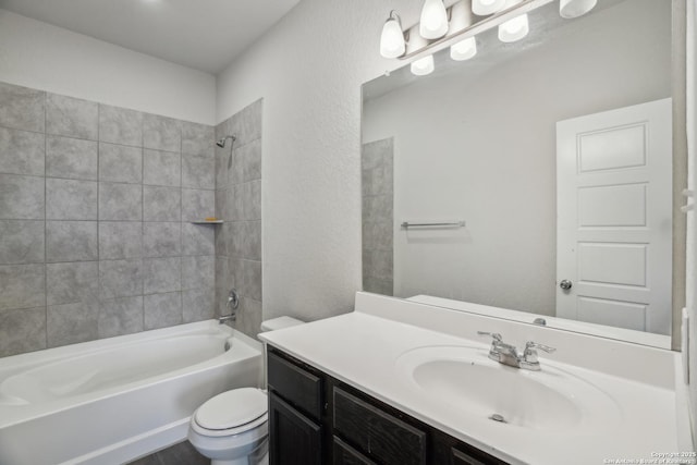 bathroom featuring shower / tub combination, vanity, and toilet