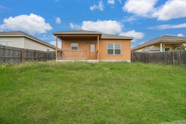 back of property with a fenced backyard