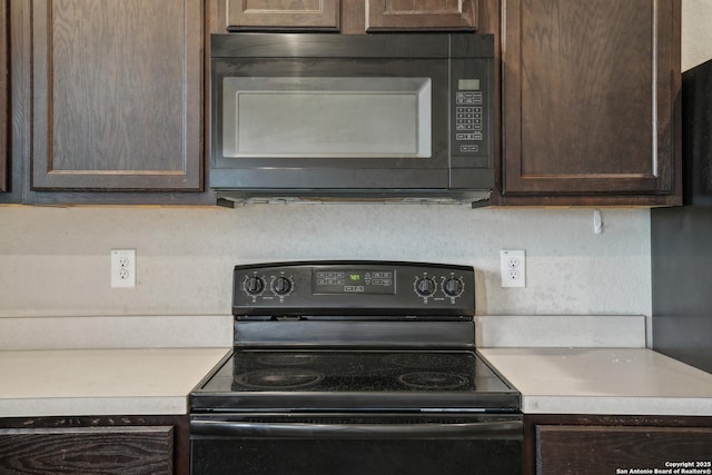 kitchen with black appliances, dark brown cabinets, and light countertops