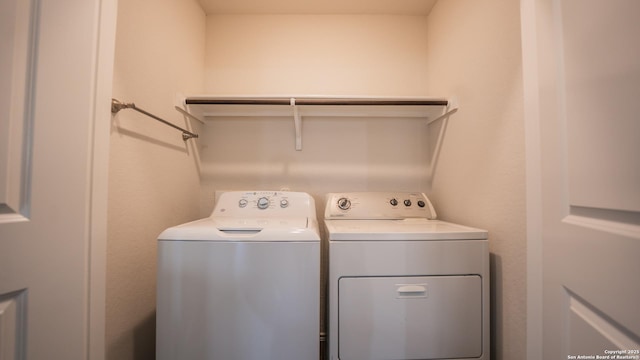 laundry room featuring washer and dryer and laundry area