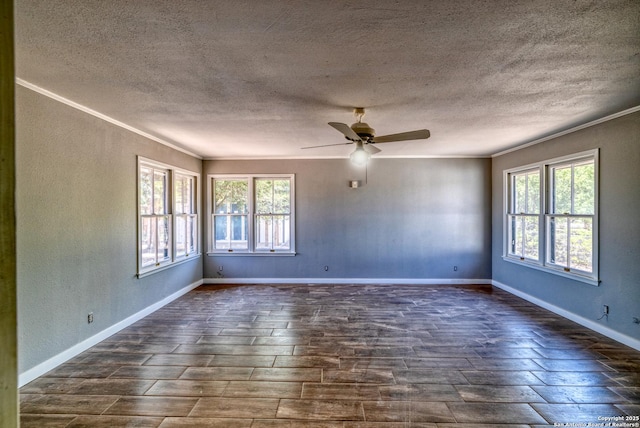 empty room with dark wood-style floors, crown molding, a ceiling fan, baseboards, and a textured ceiling