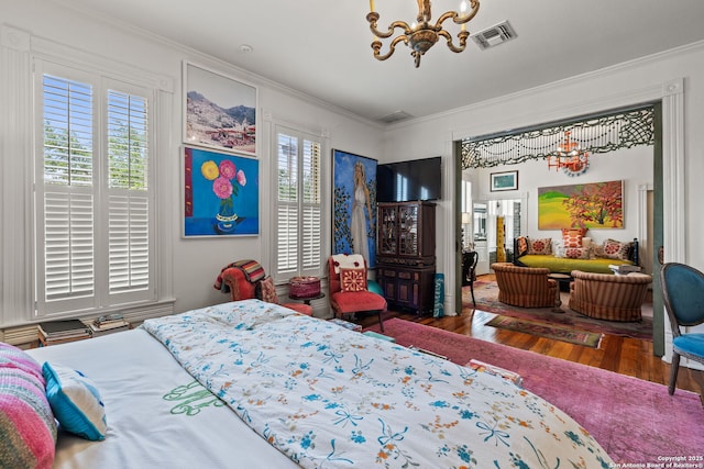 112 King William, San Antonio, TX 78204 - bedroom with crown molding, a notable chandelier, wood finished floors, and visible vents
