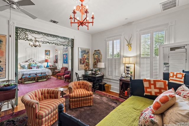 112 King William, San Antonio, TX 78204 - bedroom featuring visible vents, hardwood / wood-style flooring, a notable chandelier, and crown molding